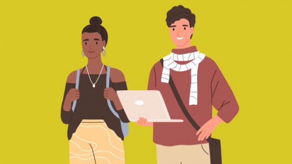 Teens holding a laptop, smiling.