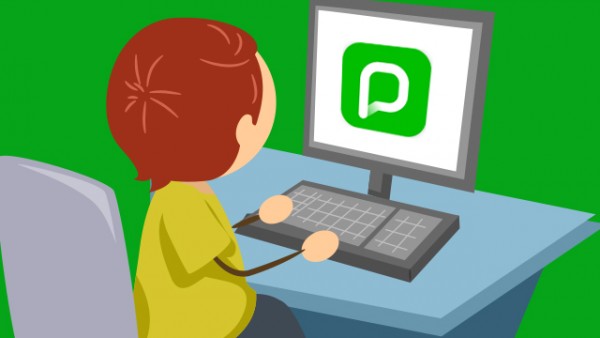 Little boy browsing Pressreader on his computer