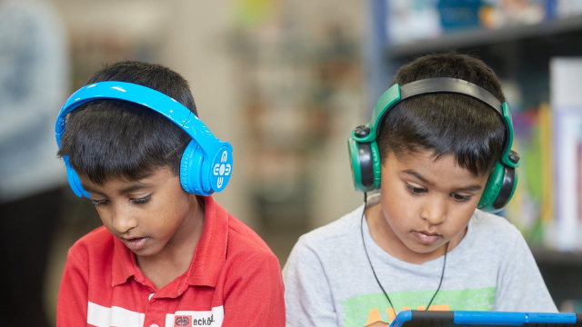 Two little boys listening to Talking Books