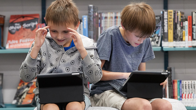 Two boys in iPads